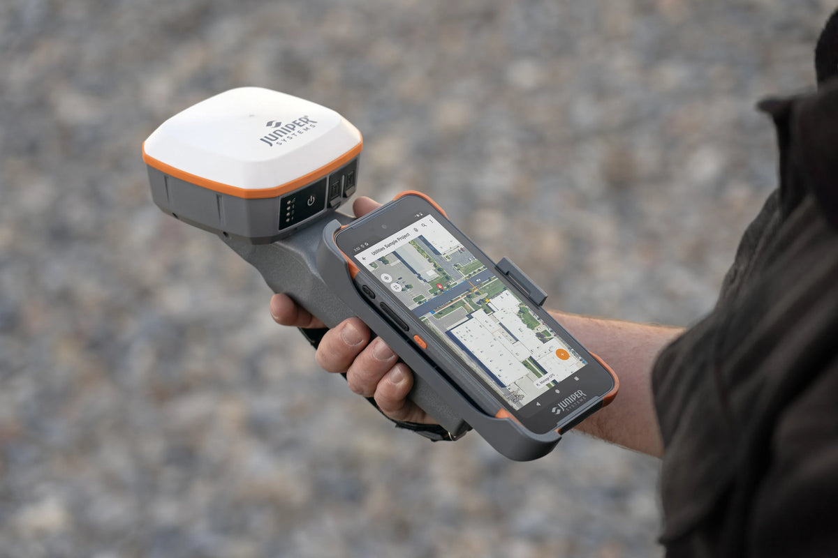 Juniper GNSS handheld displaying a detailed site map during field data collection