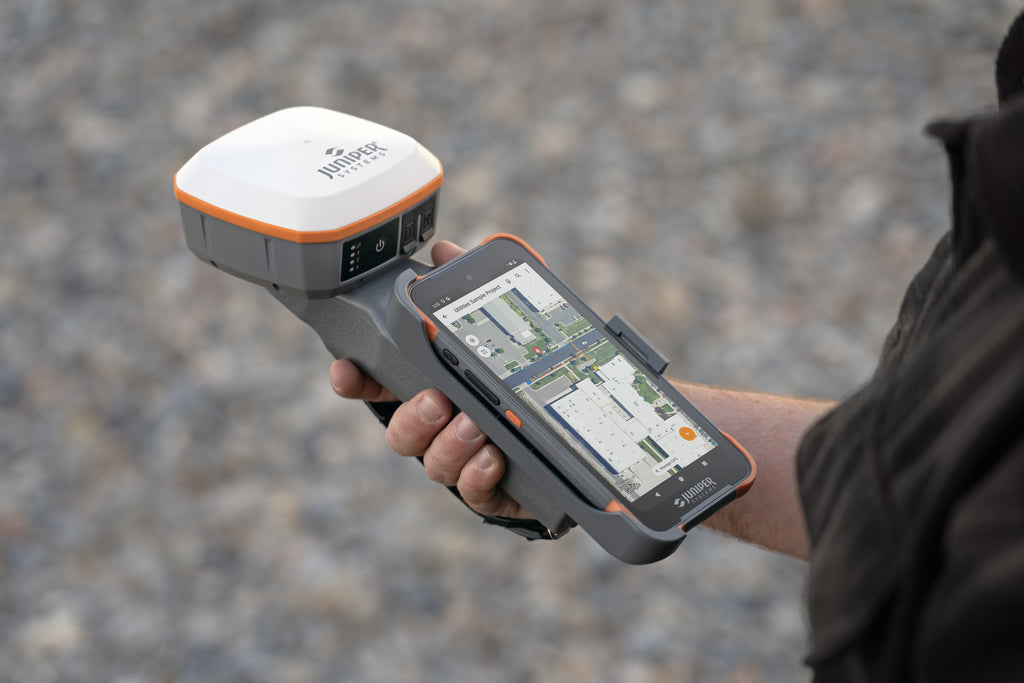 The Geode GNSS Receiver mounted on a Grip and with the Archer 4 Smartphone running Uinta data collection application.
